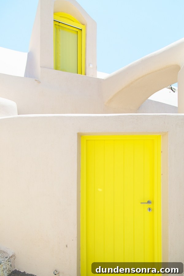 Honeymoon in Santorini: Meet the Mindells' Romantic Getaway 5 A yellow door