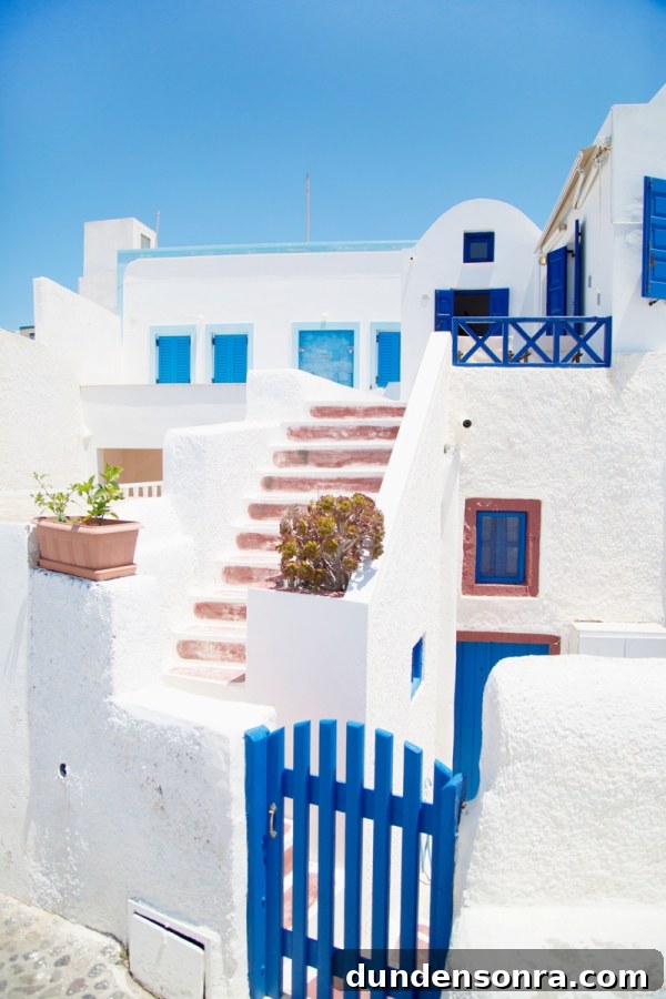 Honeymoon in Santorini: Meet the Mindells' Romantic Getaway 6 White building with blue doors and windows