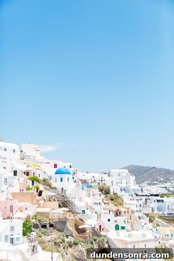 Honeymoon in Santorini: Meet the Mindells' Romantic Getaway 8 White buildings with colorful windows