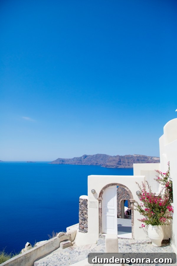 Honeymoon in Santorini: Meet the Mindells' Romantic Getaway 9 White building on the coast