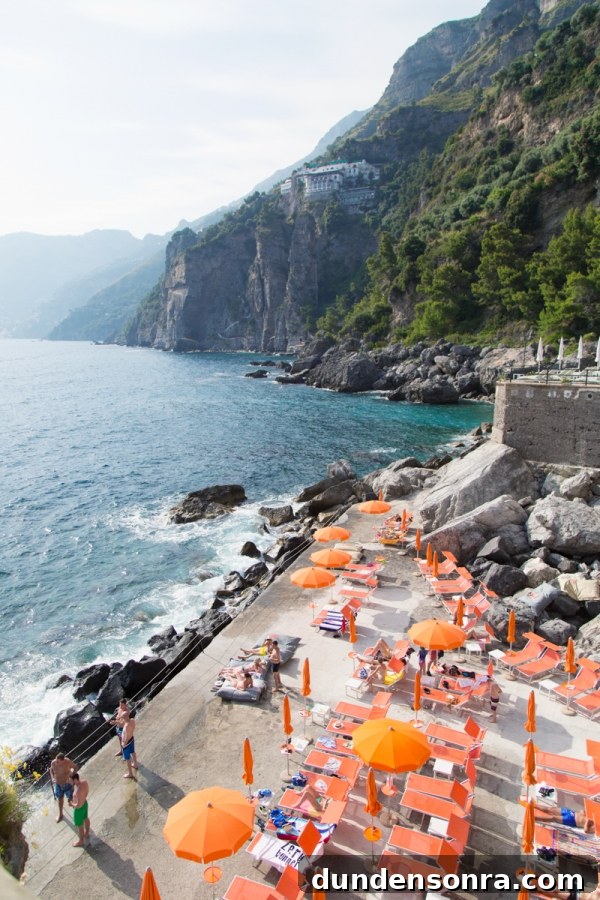 Honeymoon in Amalfi Coast: Our Romantic Italian Escape 11 Beach with orange umbrellas