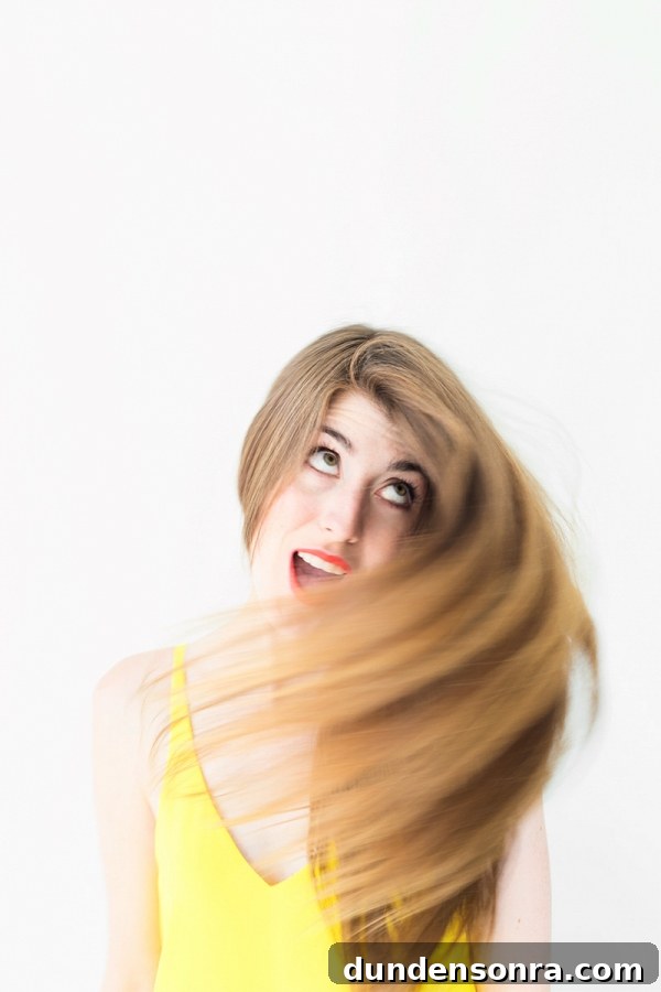 How to Make Your Lipstick Last All Day: 2 Proven Methods 4 A woman whipping her hair around