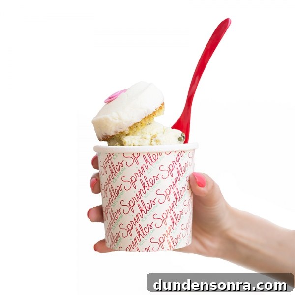Someone holding a cup with ice cream