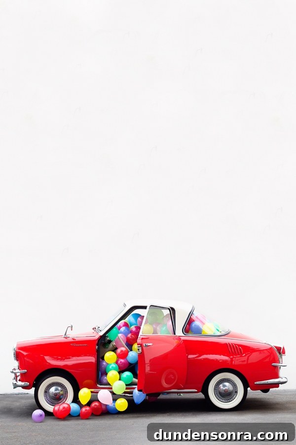 DIY Funky Hood Ornaments: Creative Ideas and How to Make Them 5 A red car with balloons in it