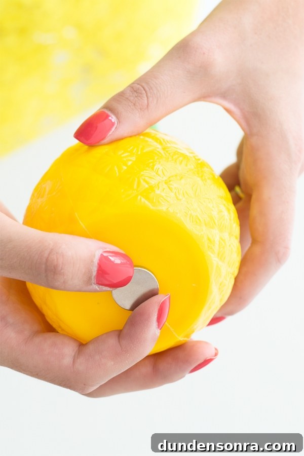 DIY Funky Hood Ornaments: Creative Ideas and How to Make Them 8 Someone holding a fake pineapple