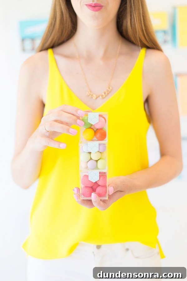 Sugarfina Pasadena: Where to Buy Luxury Candy in Pasadena 3 A woman wearing a yellow shirt and holding candy