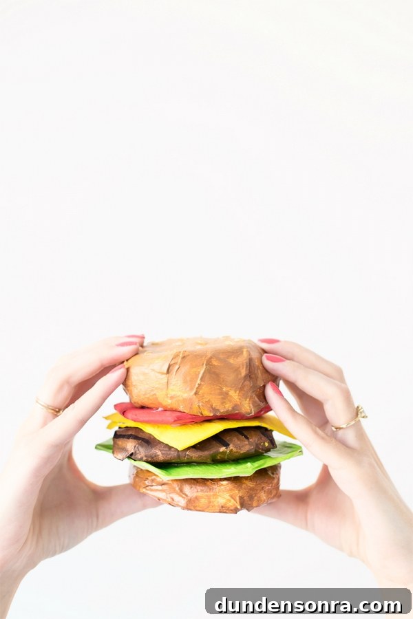 DIY Paper Mache Burger and Fries Craft (Plus Giveaway) 2 Someone holding a paper mache burger