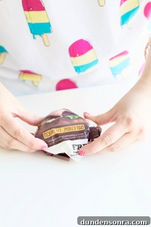 DIY Paper Mache Burger and Fries Craft (Plus Giveaway) 6 Someone holding brown paper