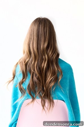 A woman with wavy brunette hair