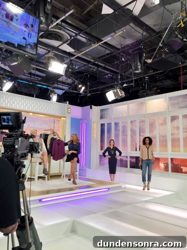 A group of people standing in a room being filmed