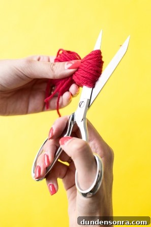 DIY Ice Cream Sneakers: How to Paint and Customize Your Shoes 13 Someone cutting red string