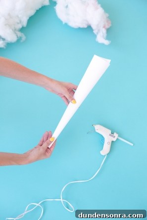 Someone rolling white paper