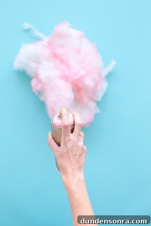 Someone spray painting cotton pink