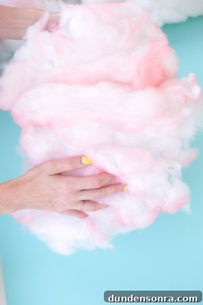 Someone holding pink cotton candy