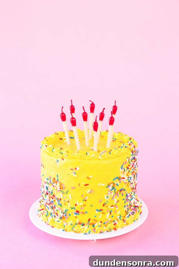 Yellow cake with candles on it