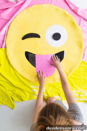 DIY Emoji Dog Bed Tutorial: Make a Cute Plush Pet Pillow 7 Someone holding an emoji pillow