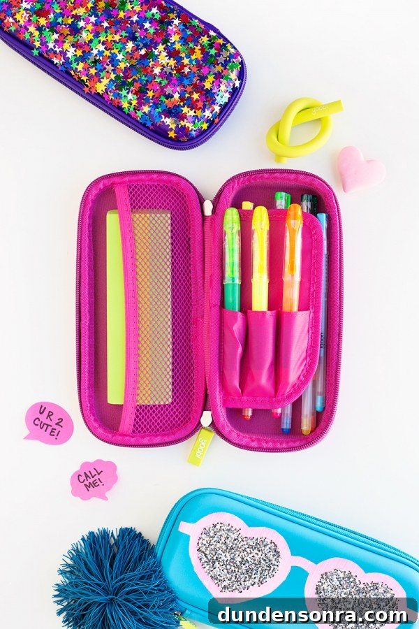 Pink pencil case with pens in it 