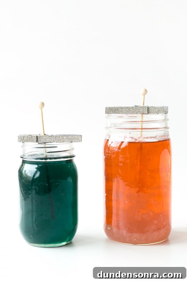 Two jars with colorful liquid in it