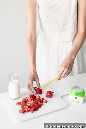 Someone cutting strawberries 