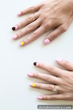 Banana Split Nail Art Ideas: Fun DIY Manicure Designs 5 Someone with pink and yellow nails