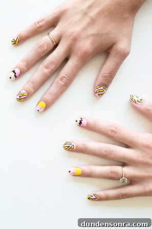 Banana Split Nail Art Ideas: Fun DIY Manicure Designs 9 Someone with pink and yellow nails