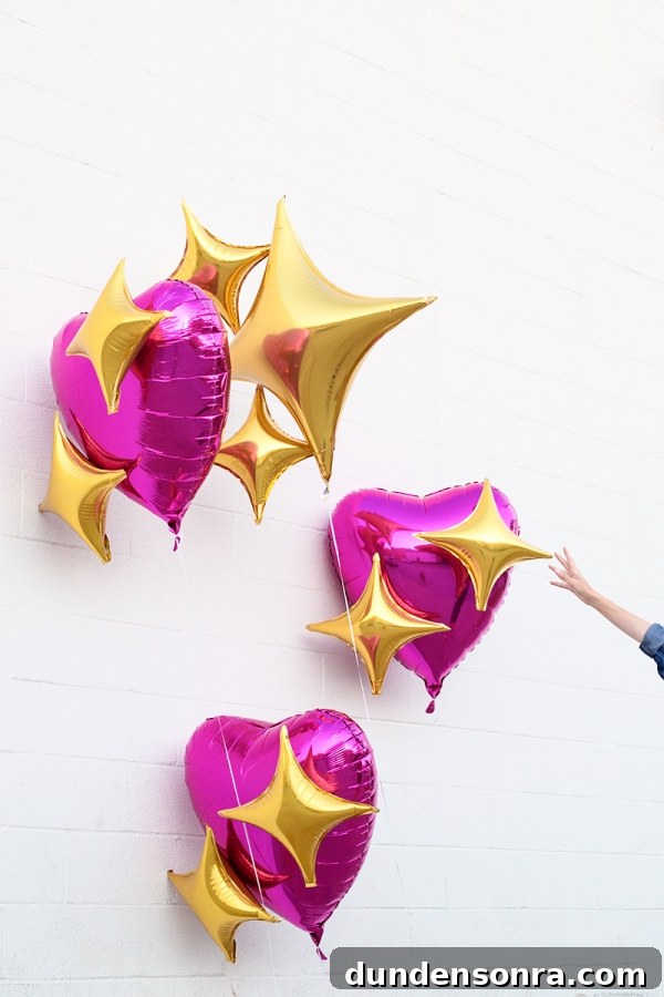 Pink heart and star emoji balloons