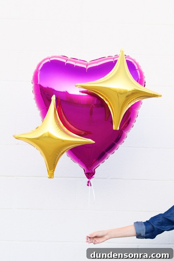 Pink heart and star emoji balloon