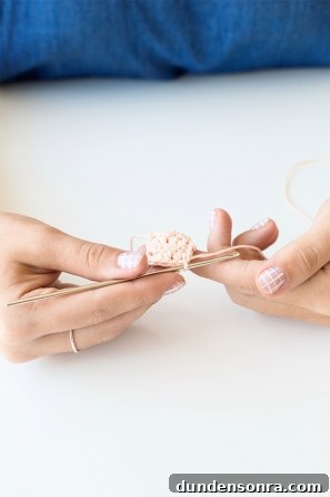 Someone knitting a small item