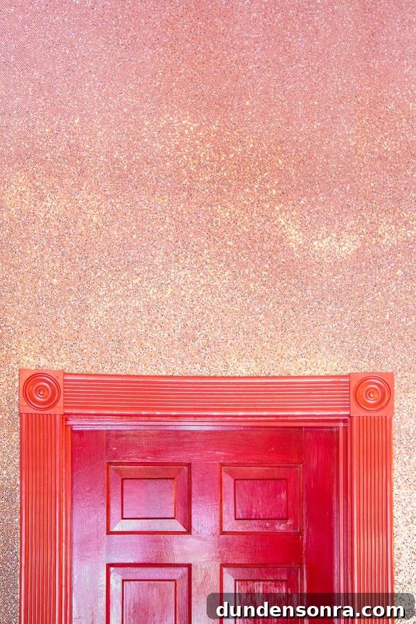 A door frame and pink wall