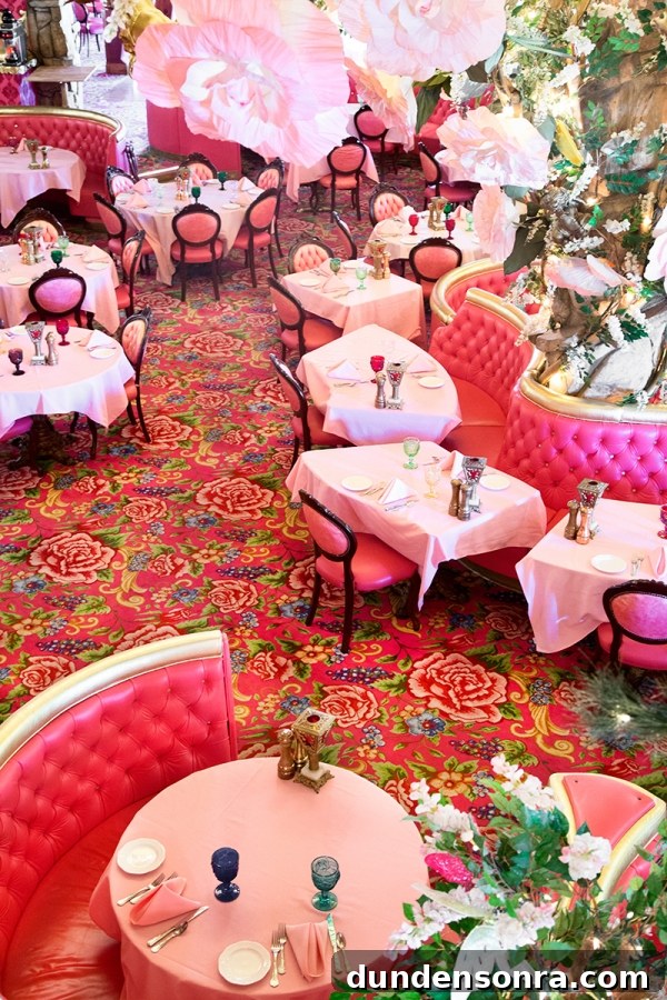 Pink couches and chairs in a room