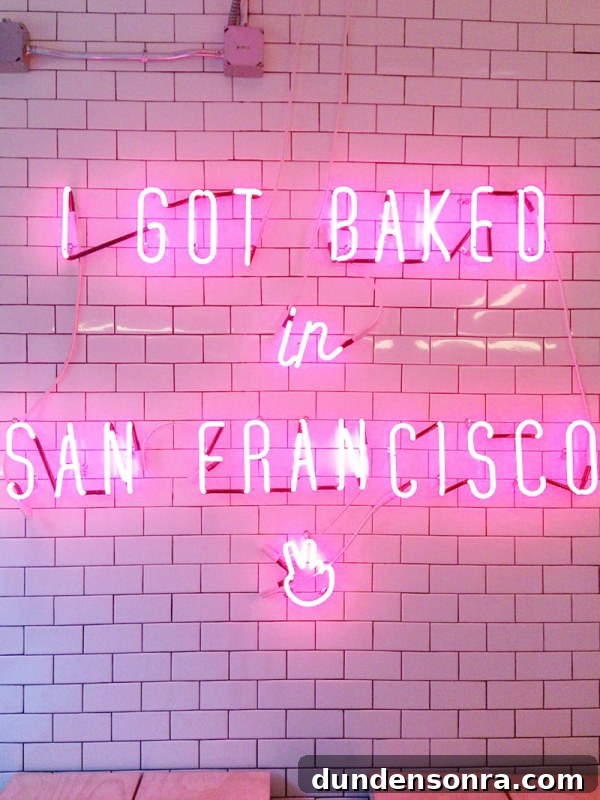 Mr. Holmes Bakehouse: Signature Sugar Creations You Can't Miss 3 A pink neon sign on a wall
