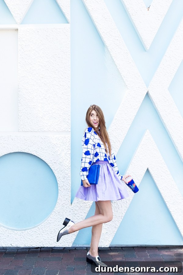 3 Bold Colorful Fall Outfits to Elevate Your Wardrobe 2 A woman in a purple outfit