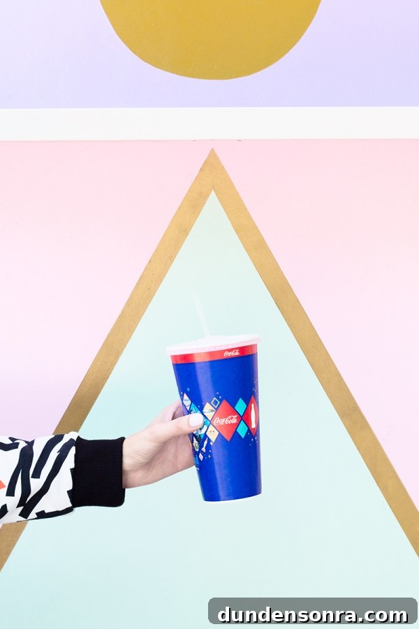 3 Bold Colorful Fall Outfits to Elevate Your Wardrobe 16 Someone holding a drink