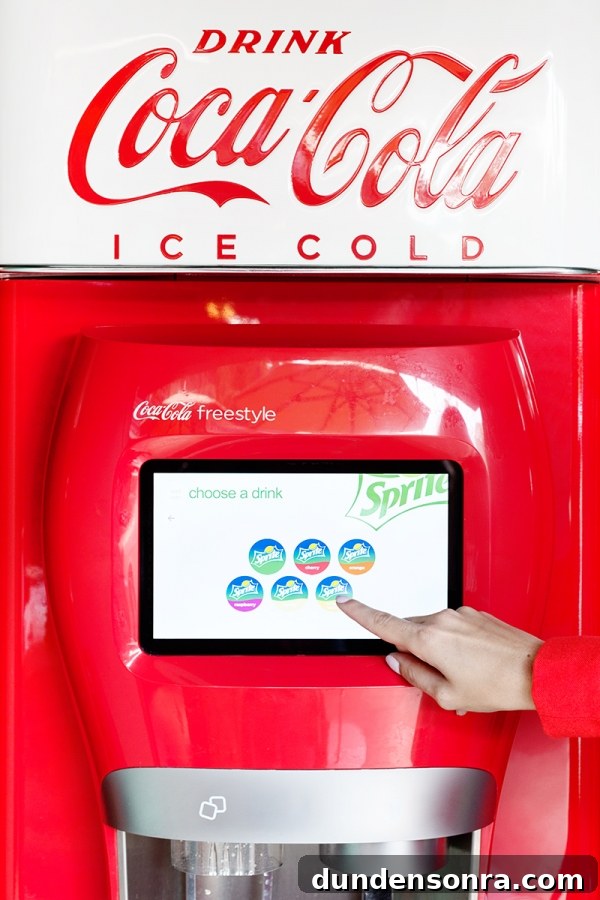 3 Bold Colorful Fall Outfits to Elevate Your Wardrobe 7 Someone selecting a drink on a drink machine