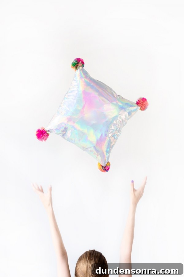 Someone throwing a pillow in the air