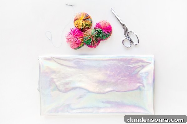 Holographic fabric, scissors, and colorful balls