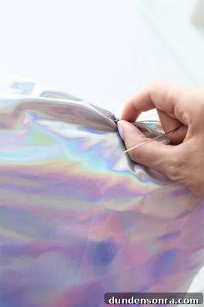 Someone pinching holographic material 