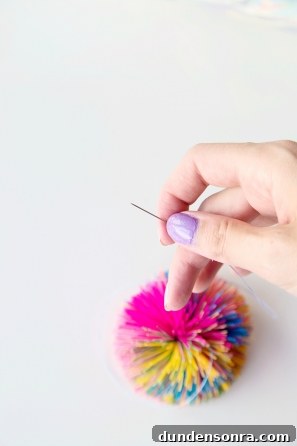 Someone holding a tiny pin