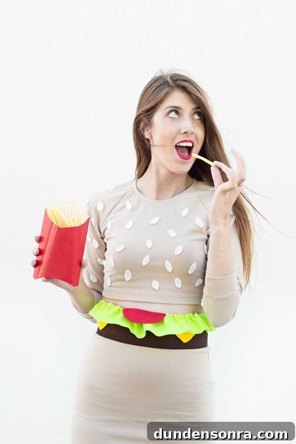 DIY Burger Costume Ideas: Creative Homemade Burger Halloween Outfit 4 A woman in a burger costume, eating fries