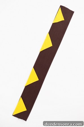 A close up of a black and yellow paper