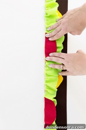 Someone gluing felt together
