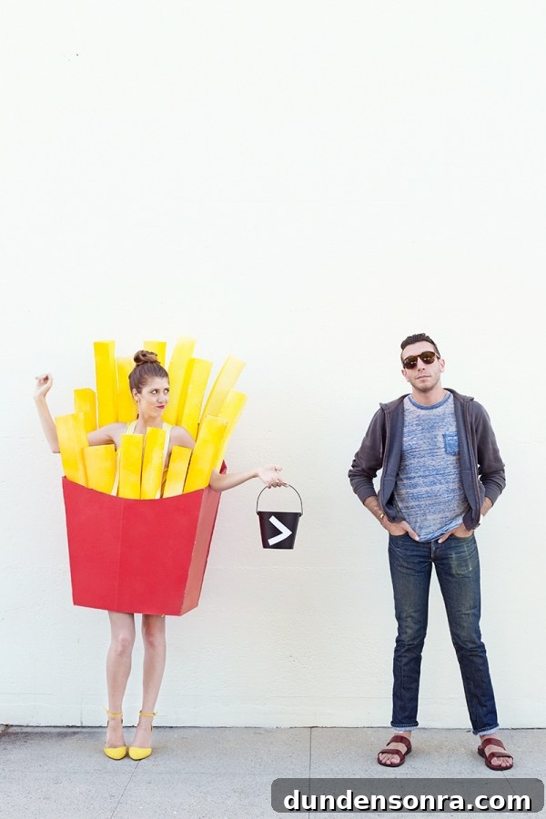 A woman in a fry costume and a man next to her