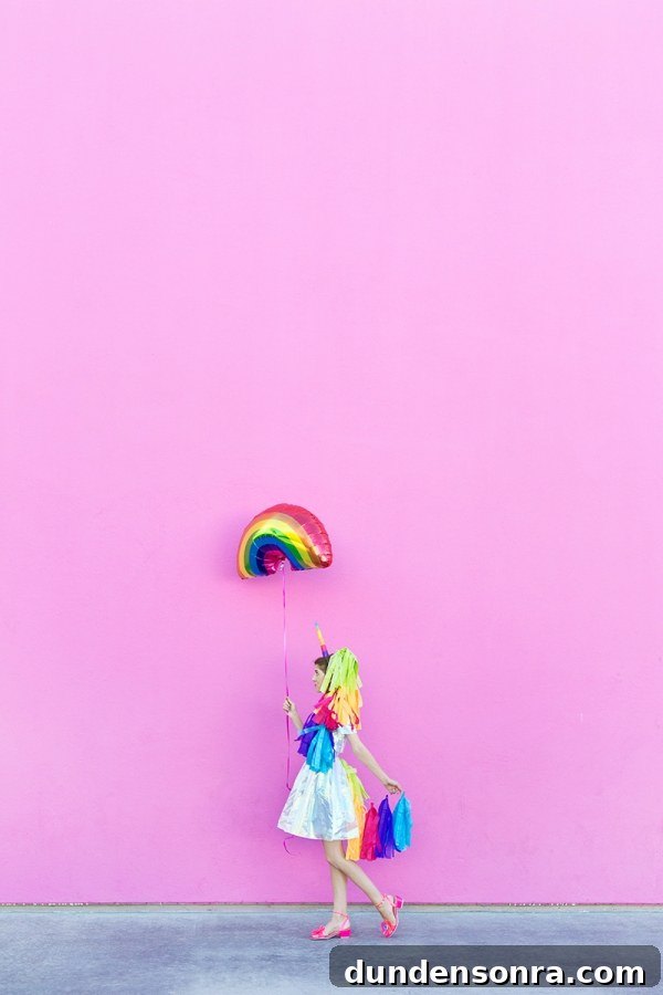 DIY Lisa Frank Costume Ideas for Colorful 90s-Inspired Looks 13 A woman dressed in a unicorn costume