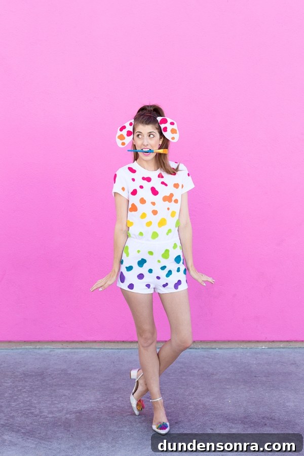 DIY Lisa Frank Costume Ideas for Colorful 90s-Inspired Looks 3 A woman wearing a white outfit with rainbow dots on it