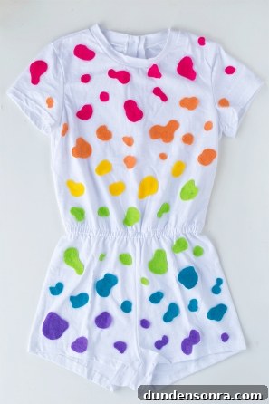 A white jumpsuit with colorful dots on it