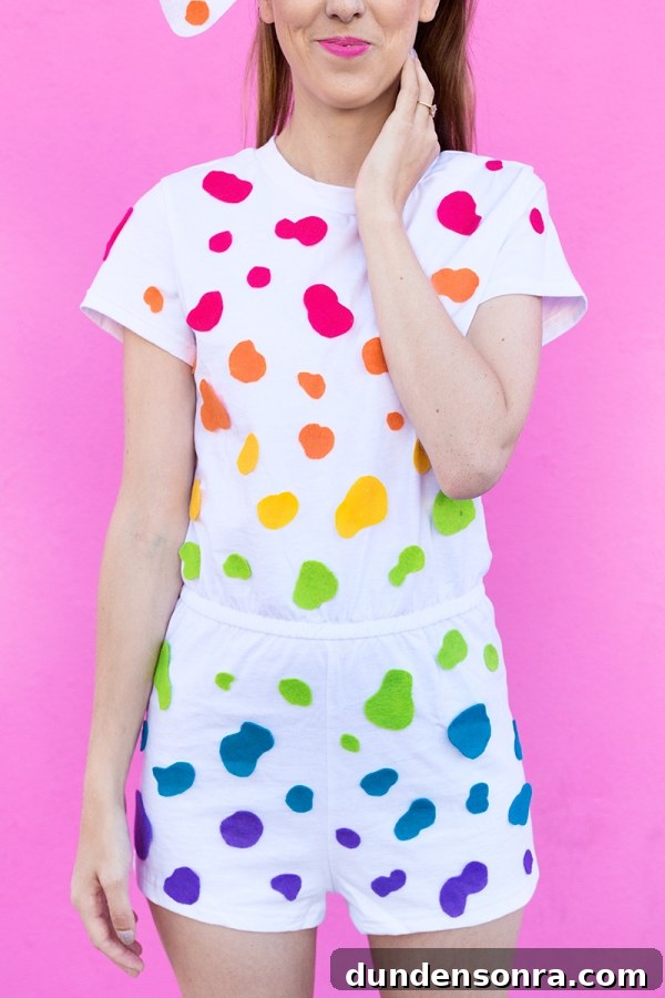 DIY Lisa Frank Costume Ideas for Colorful 90s-Inspired Looks 23 A woman wearing a white outfit with rainbow dots on it