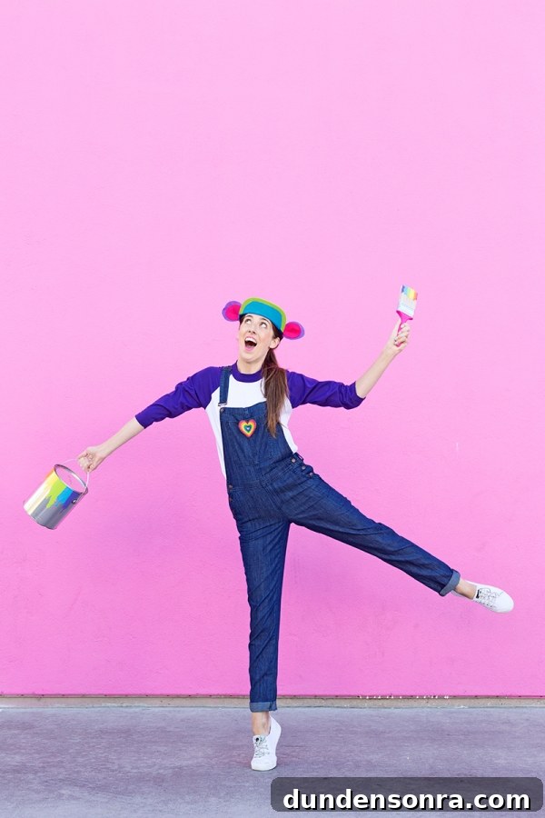 DIY Lisa Frank Costume Ideas for Colorful 90s-Inspired Looks 31 A woman in overalls in front of a pink wall