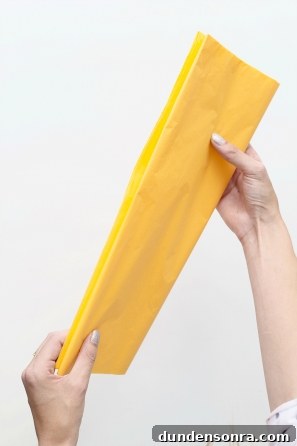 Someone holding yellow paper