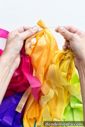 DIY Lisa Frank Costume Ideas for Colorful 90s-Inspired Looks 10 Someone holding colorful paper