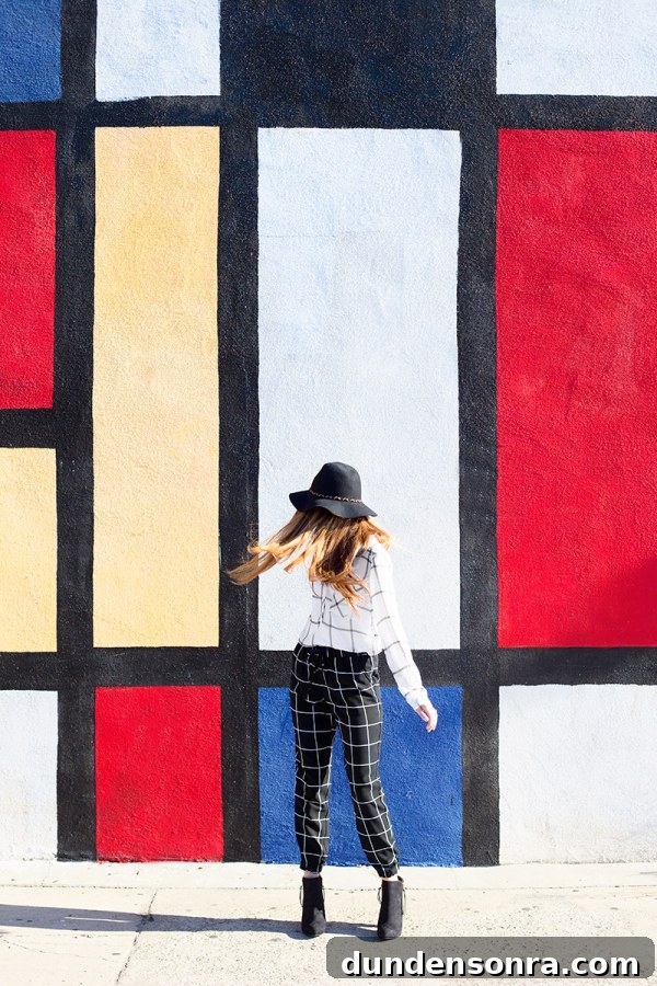 Plaid You at Hello: Two Fall Plaid Outfits from Target 2 A woman standing in front of a colorful wall